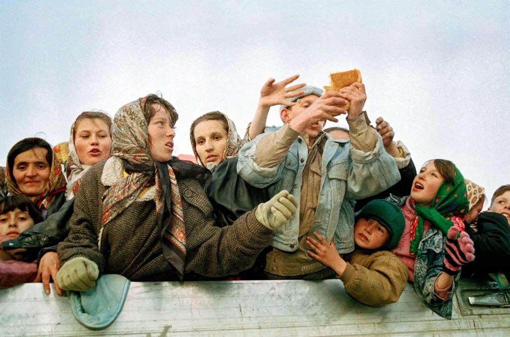 Women and children on a truck