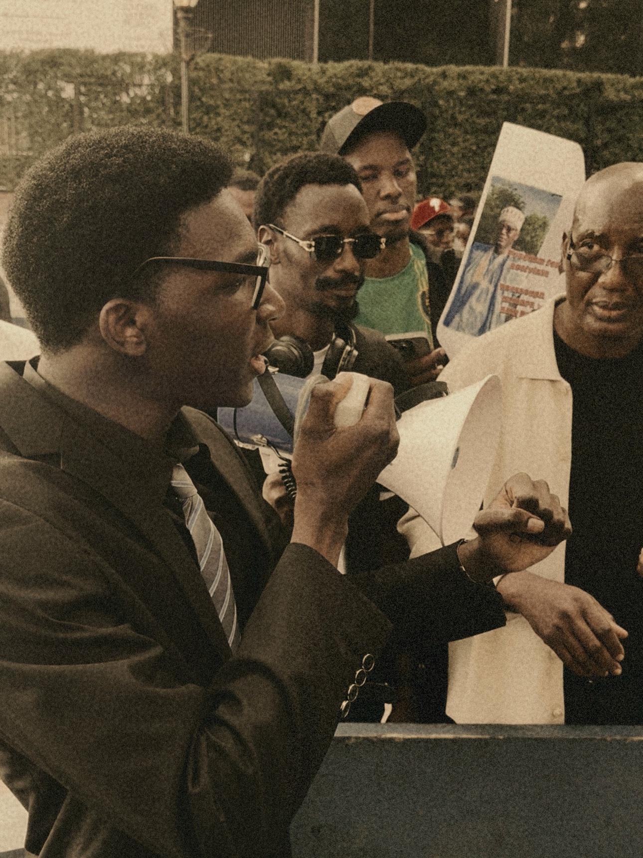 Speaking into a megaphone at a gathering